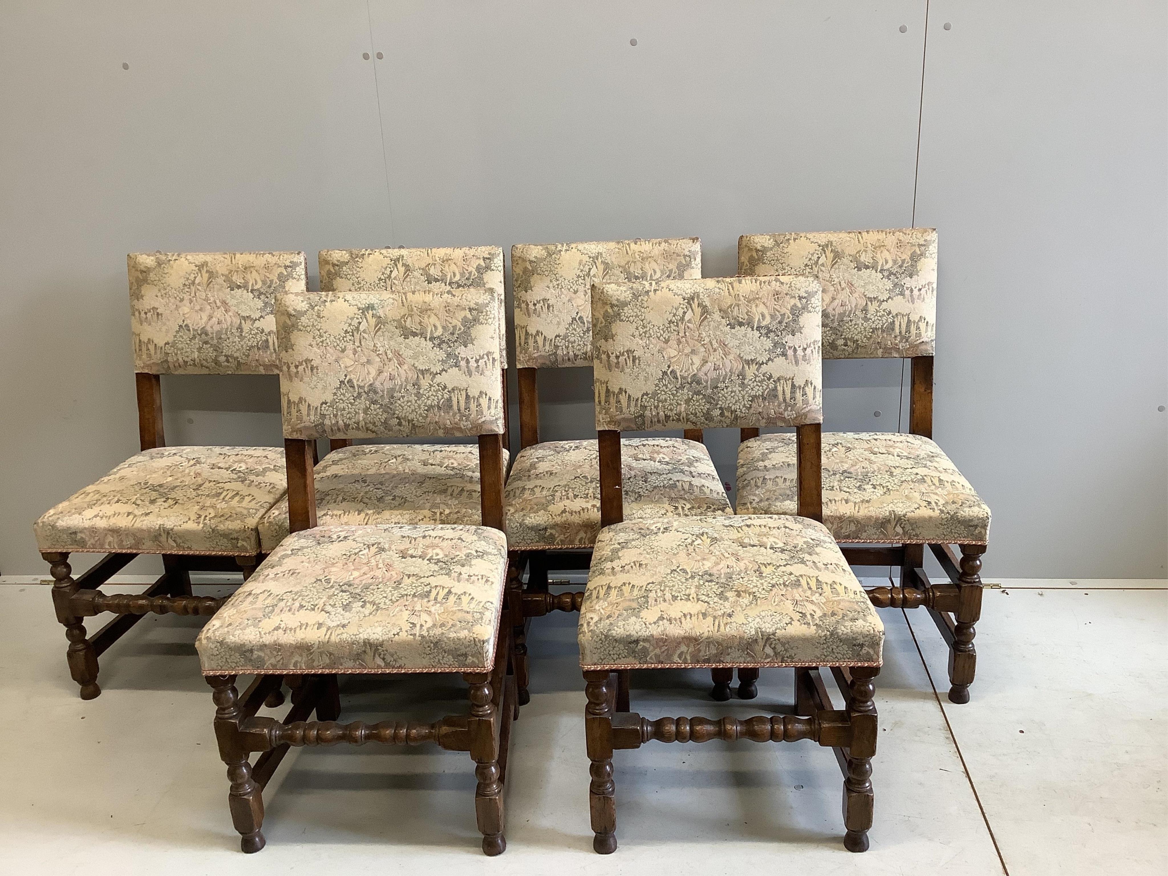 A 17th century style oak drop leaf refectory dining table, opens to 183 x 101cm, height 74cm, with a set of six Cromwellian style oak dining chairs. Condition - table with some marking to the top, upholstery to chairs wo